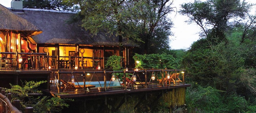 Madikwe River Lodge exterior at dusk - Image 5