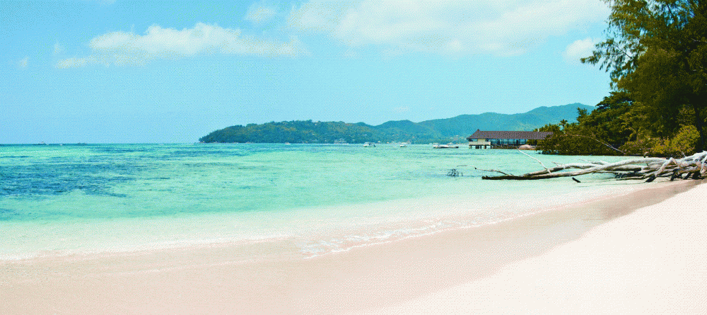 The stunning shades of blue at New Emerald Cove, Praslin, Seychelles - Image 8