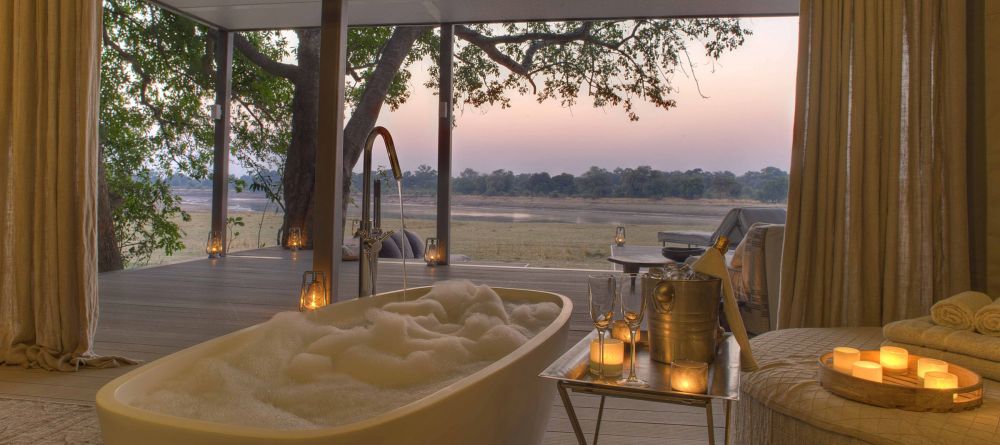 Even the luxurious private soaking tubs have beautiful views over the river at Chinzombo, South Luangwa National Park, Zambia - Image 11