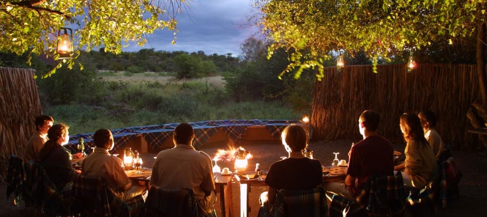 Campfire at dusk at Mashatu Tented Camp, Mashatu Game Reserve, Botswana - Image 17