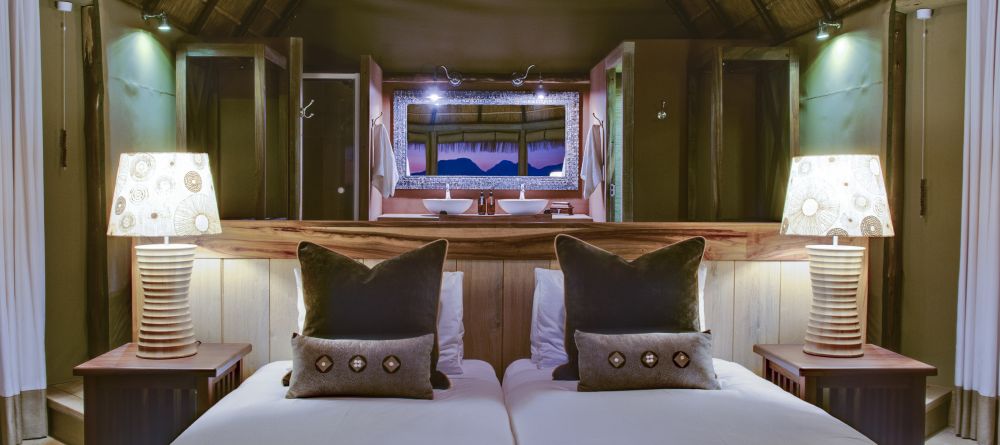 The bedroom with bathroom behind at Mowani Mountain Camp, Damaraland, Namibia - Image 10