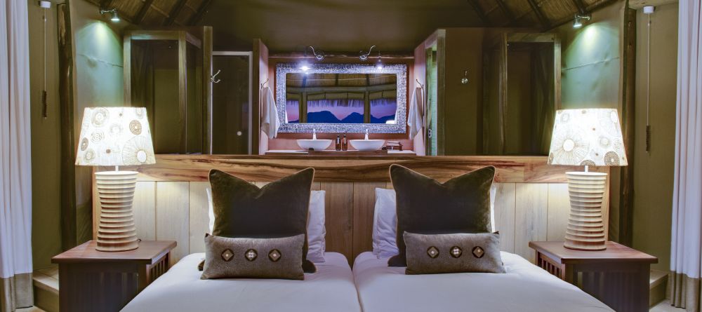 The bedroom with bathroom behind at Mowani Mountain Camp, Damaraland, Namibia - Image 3