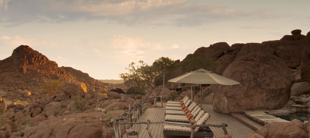 The veranda with pool and sunloungers at Mowani Mountain Camp, Damaraland, Namibia - Image 4