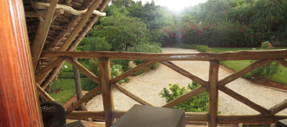 The garden veranda overlooks the lush foliage and manicured lawns at Villa Turquoise, Zanzibar, Tanzania (Mango staff photo) - Image 2