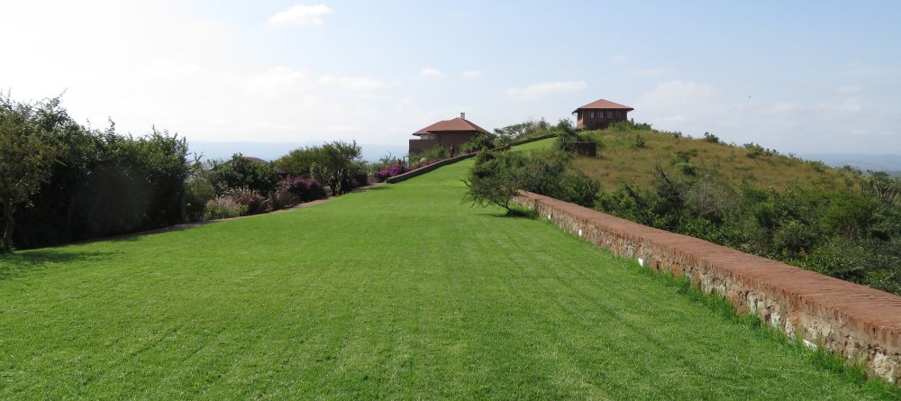 The sweeping manicured lawn extends up towards the main building at Bashay Rift Lodge, Karatu, Tanzania (Mango staff photo) - Image 6