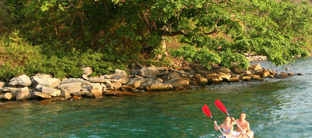 Exploring the coastline in kayaks at Kungwe Beach Lodge, Mahale Mountains National Park, Tanzania - Image 12