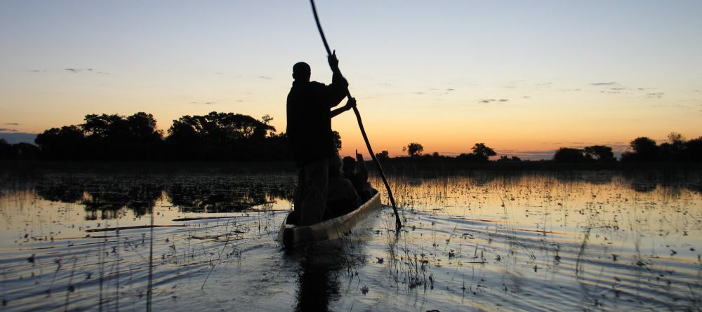 Boating at sunset at Guma Lagoon Camp, Okavango Delta, Botswana - Image 18