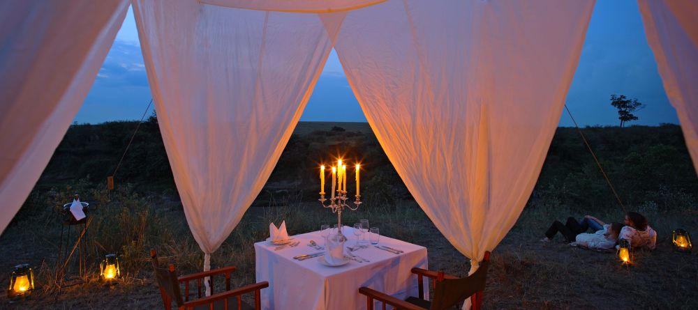 Elegant outdoor evening dining at Naibor Camp, Masai Mara National Reserve, Kenya - Image 14