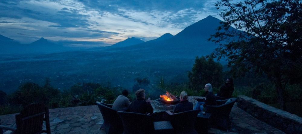 Campfire overlooking mountains and valley at Virunga Lodge, Volcanoes National Park, Uganda - Image 27