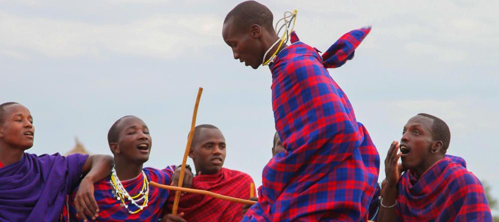Masai tribesmen engage in a traditional jumping dance at Chem Chem Lodge, Lake Manyara National Park, Tanzania - Image 12