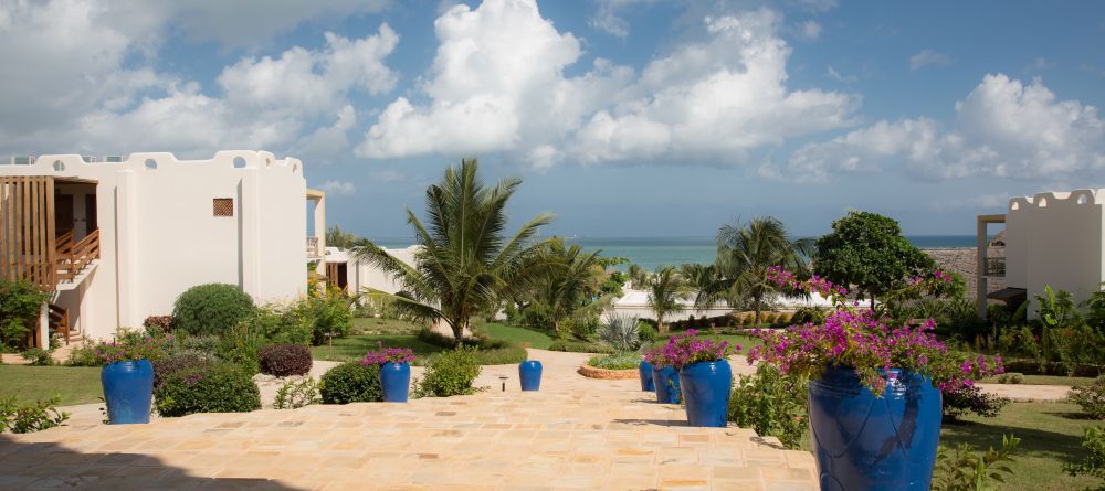 The flower-dotted grounds overlooking the turquoise waters at Gold Zanzibar Beach House & Spa, Zanzibar, Tanzania  - Image 11