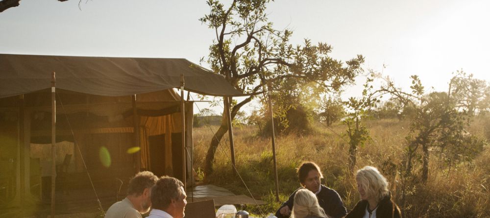 Dining outdoors at Nomad Serengeti Safari Camp- Ndutu, Serengeti National Park, Tanzania - Image 1