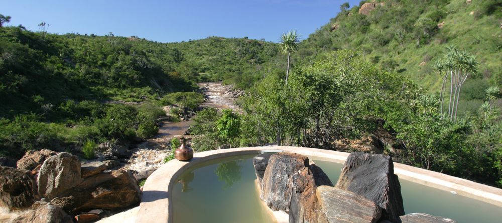 View of the Ewas Nyiro River from the Eagle Cottage at Sabuk Lodge, Laikipia, Kenya - Image 1