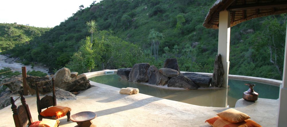 The private pool, with the natural surroundings incorporated into its design, allows for relaxation at the Eagle Cottage at Sabuk Lodge, Laikipia, Kenya - Image 3