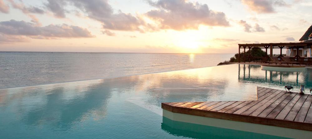Marvel at the endless ocean and blue skies from your lounge chair at Essque Zalu Zanzibar, Zanzibar, Tanzania - Image 2