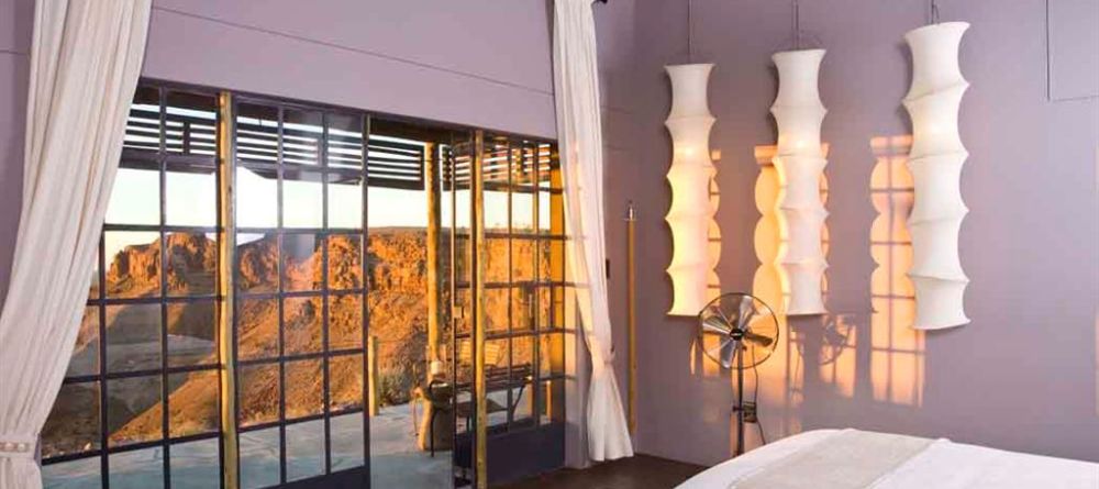 Fish River Canyon Lodge - Bedroom, Patio and Landscape View - Image 10