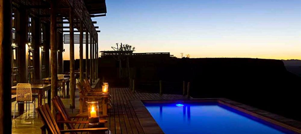 Fish River Lodge - Pool and Patio at Dusk - Image 23