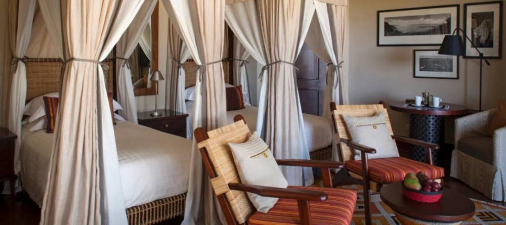 A luxury twin bedroom at The Four Seasons Safari Lodge, Serengeti National Park, Tanzania - Image 9