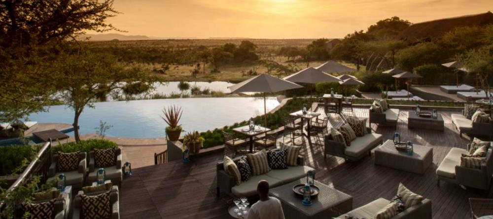 Relax in the sunshine on the spacious lounge deck while listening to the sounds of the Serengeti at The Four Seasons Safari Lodge, Serengeti National Park, Tanzania - Image 1
