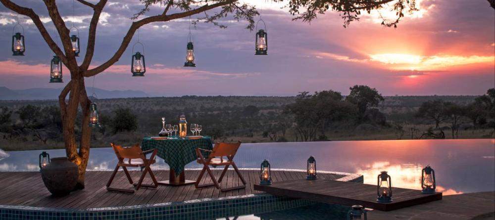 Share a private romantic dinner as the sun sets over the plains at The Four Seasons Safari Lodge, Serengeti National Park, Tanzania - Image 19