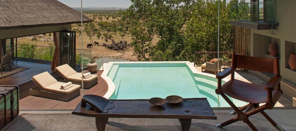 Lounge by a private pool overlooking a herd of elephants at the watering hole at The Four Seasons Safari Lodge, Serengeti National Park, Tanzania - Image 17