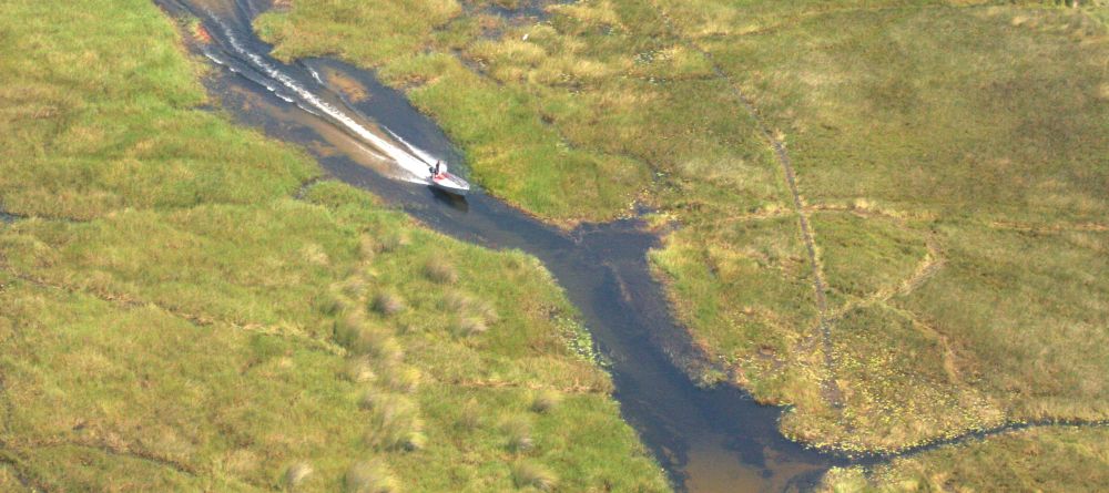 Aerial view of boating through the delta at Gunns Camp, Okavango Delta, Botswana - Image 3