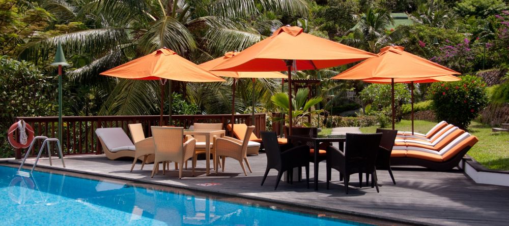 The pool and sun loungers at Hotel L Archipel, Praslin, Seychelles - Image 3