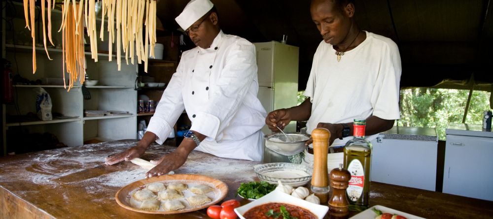 The chef team prepares fresh pasta and a sauce made from scratch at Offbeat Mara Camp, Masai Mara National Reserve, Kenya - Image 4