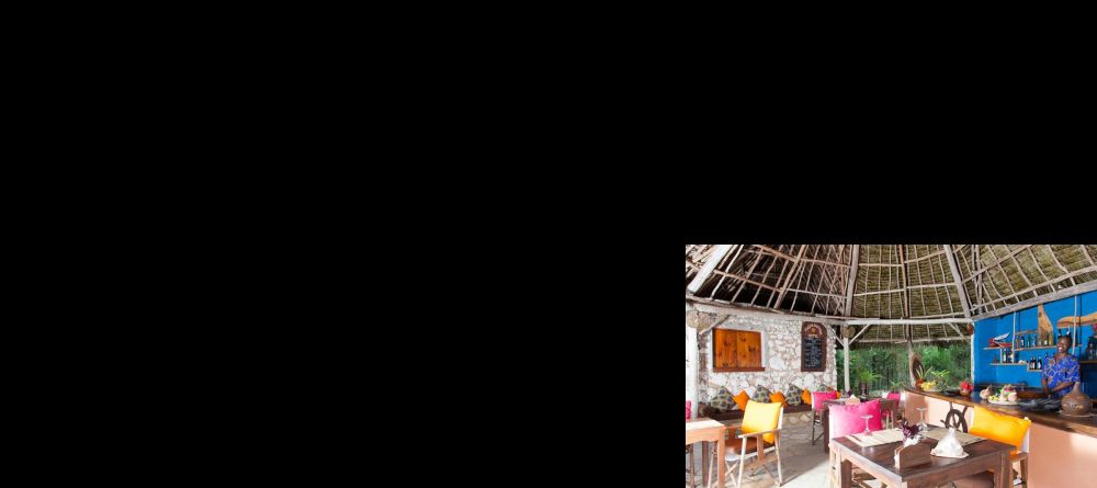 Enjoy a meal in the colorful, open air dining area at Kasha Boutique Hotel, Zanzibar, Tanzania - Image 9