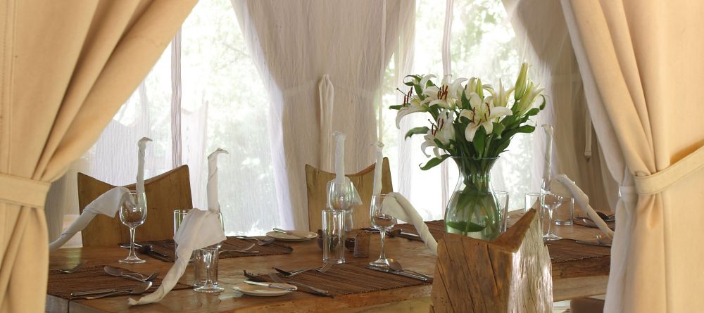 An elegant table setting in the dining area at Naibor Camp, Masai Mara National Reserve, Kenya - Image 8