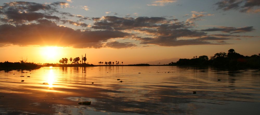 The sunset over the lake at Lake Manze Tented Camp, Selous National Park, Tanzania - Image 7