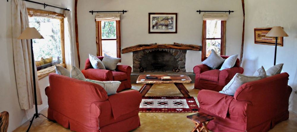 Comfortable chairs and African-inspired decor create a welcoming lounge at Mara House, Masai Mara National Reserve, Kenya - Image 17