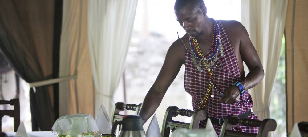 Setting the dining area at Ngare Serian Camp, Masai Mara National Reserve, Kenya - Image 19