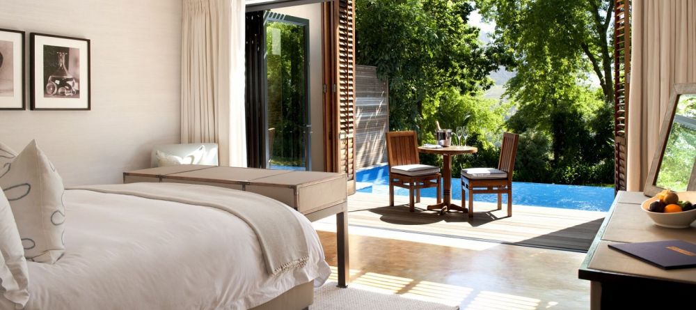 A deluxe guestroom overlooking a private plunge pool at Delaire Graff, Stellenbosch, South Africa - Image 15