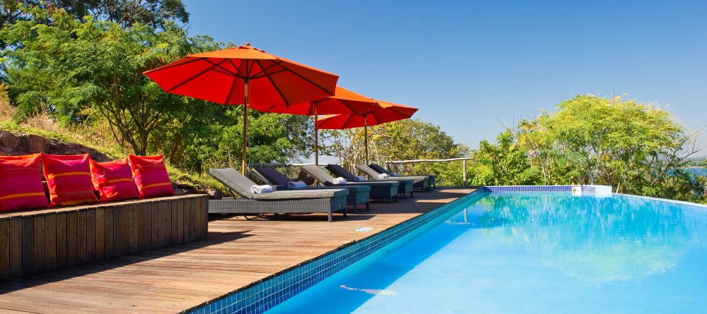 Enjoy the sun by the pool at Pumulani, Lake Malawi, Malawi - Image 10