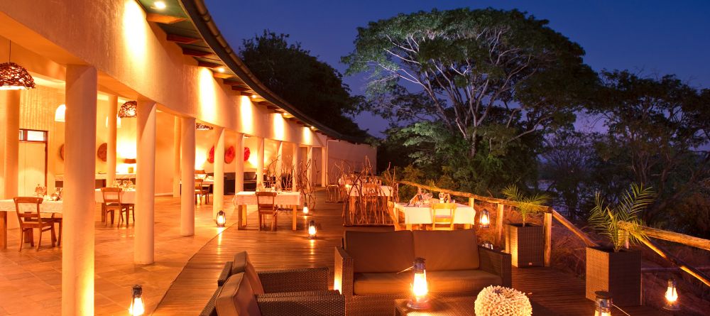 The veranda at night at Pumulani, Lake Malawi, Malawi - Image 13