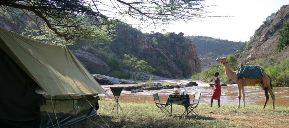The tent and lunch table set up for rest during the camel back safari at Sabuk Lodge, Laikipia, Kenya - Image 14