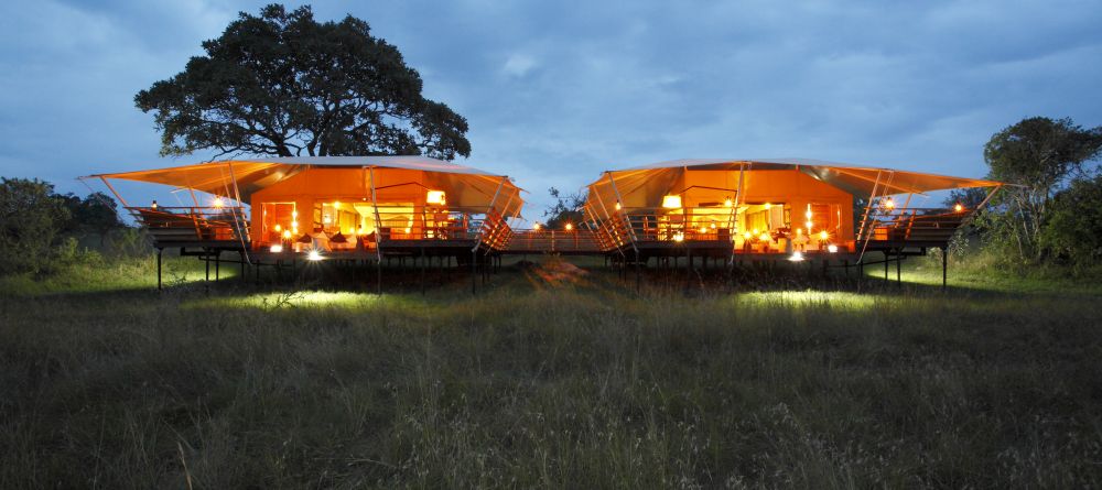Guest tents illuminated in the duskr at Serengeti Bushtops Camp, Serengeti National Park, Tanzania - Image 15