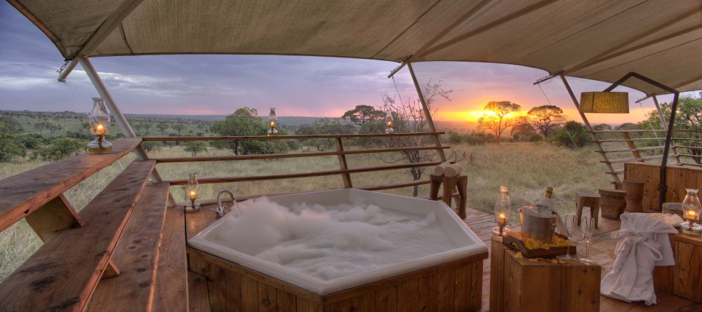 Let stress melt away as you soak in a hot tub overlooking the African sunsetr at Serengeti Bushtops Camp, Serengeti National Park, Tanzania - Image 7