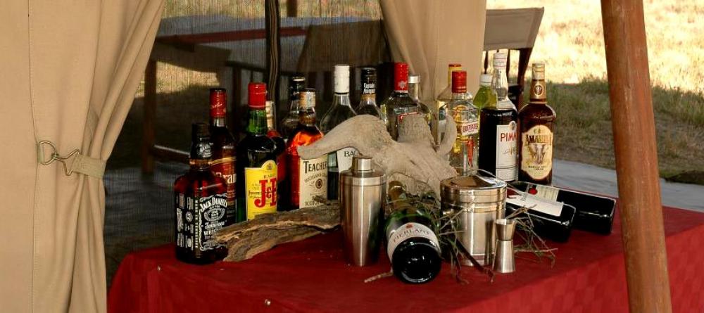 Enjoy a cocktail while gazing at the savannah at Serengeti Savannah Camps, Serengeti National Park, Tanzania - Image 5