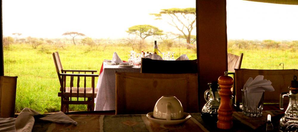 The open-air dining area looking out to the plains at Serengeti Savannah Camps, Serengeti National Park, Tanzania - Image 3