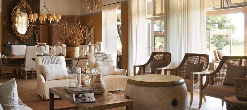 Enjoy time with family and friends in the lounge at Singita Serengeti House, Serengeti Grumeti Reserves, Tanzania - Image 4