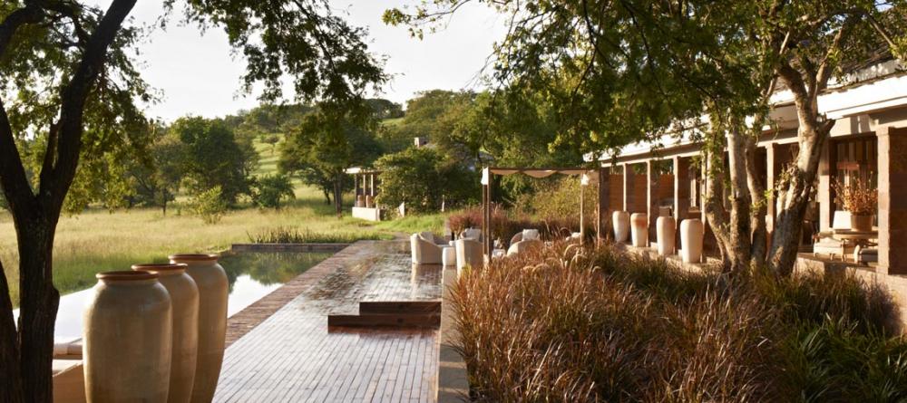 The infinity pool allows guests to enjoy the full effect of the Grumeti Reserves' natural beauty at Singita Serengeti House, Serengeti Grumeti Reserves, Tanzania - Image 7