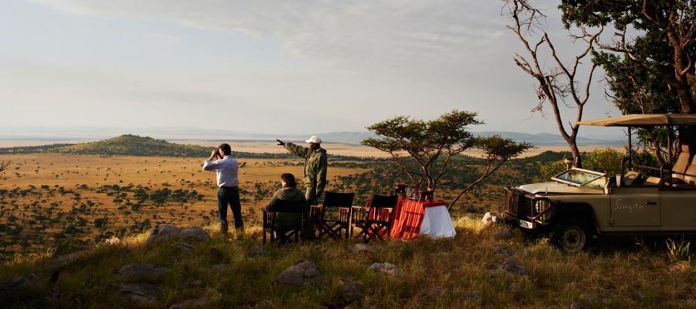 A moment of serenity during a sundowner at Singita Sasakwa Lodge, Grumeti Reserves, Tanzania - Image 4