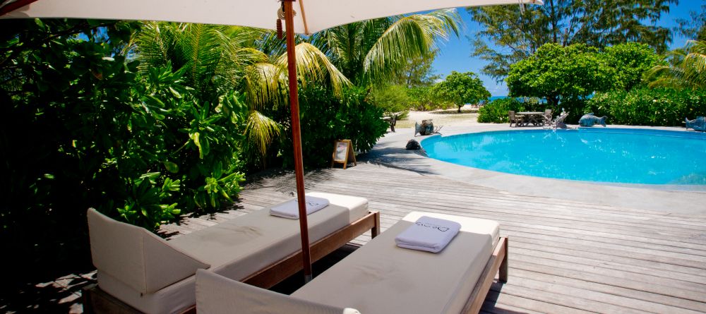 Sun loungers by the pool at Denis Island Lodge, Denis Island, Seychelles - Image 2