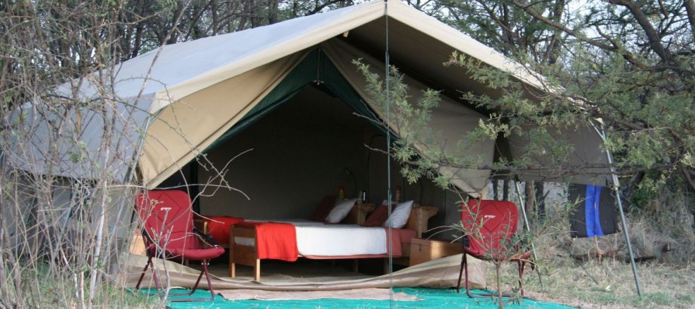The tents are nestled into the surrounding nature at Serengeti Wilderness Camp, Serengeti NCCA, Tanzania - Image 1