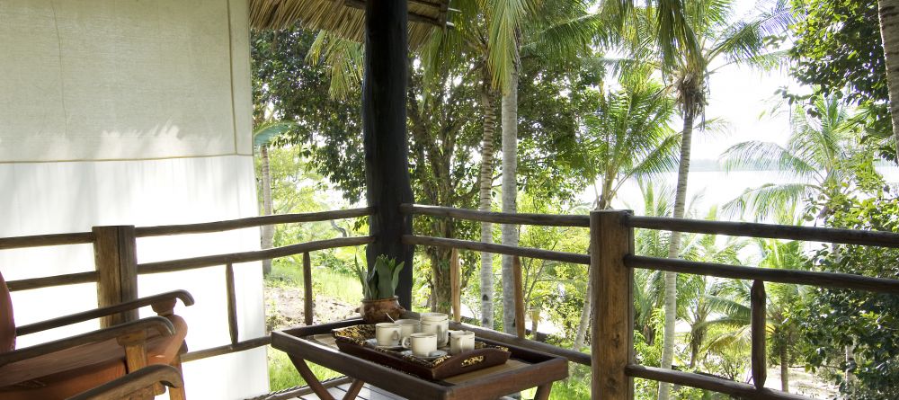 The quiet veranda with beautiful views of the palms at Pole Pole Bungalow Resort, Mafia Island, Tanzania - Image 16
