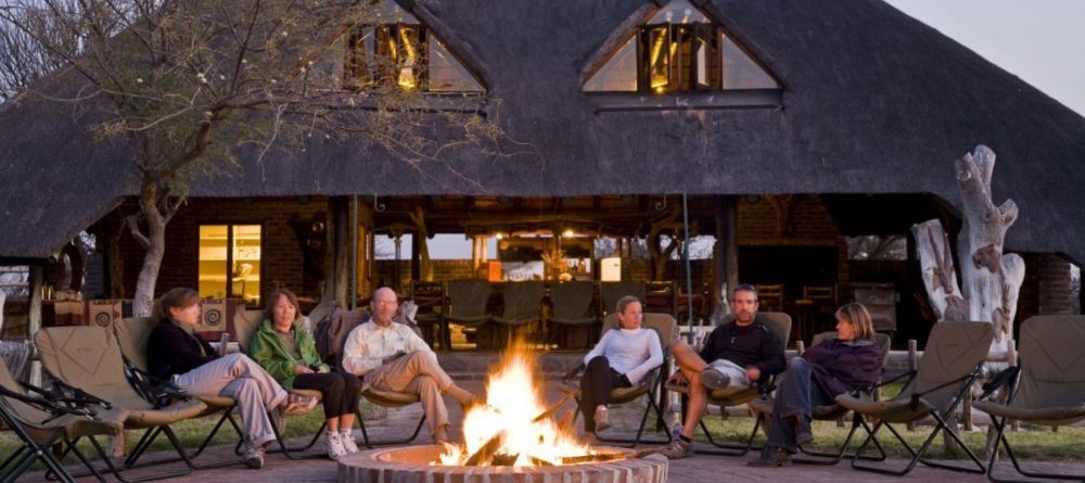 The outdoor campfire lounge area at Grasslands Bushman Lodge, Central Kalahari Game Reserve, Botswana - Image 1