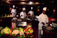 Chefs preparing the BBQ station at Serena Serengeti Safari Lodge, Serengeti National Park, Tanzania