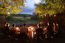 Campfire at dusk at Mashatu Tented Camp, Mashatu Game Reserve, Botswana
